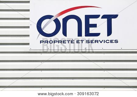 Saint Egreve, France - June 19, 2019: ONET logo on a building. ONET is today the French leader in business services in the areas of cleanliness and multiservice