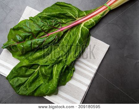 Fresh Raw Leaves Of Chard, Mangold, Swiss Chard On A Kitchen Towel