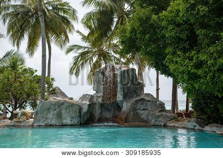 The Artificial Waterfall Near The Hotel Pool