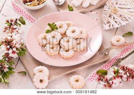 Canestrelli Biscuits With Icign Sugar On Wooden Table.