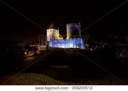 Castle In The City Of Bedzin. View At Night Backlit.