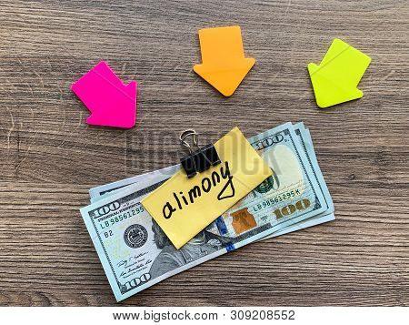 Payments Alimony. Pile Dollars With Sign Alimony And Money. Divorce And Separation Concept