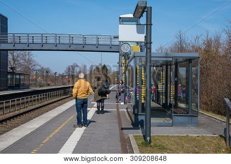 Glumso Denmark - April 8. 2019: People Waiting For The Train At Glumso Train Station