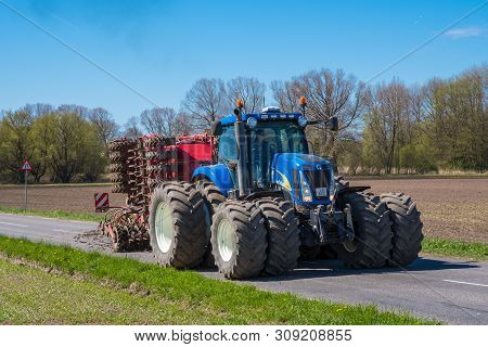 Mon Denmark - May 5. 2018: New Holland Tractor With A Seeding Machine