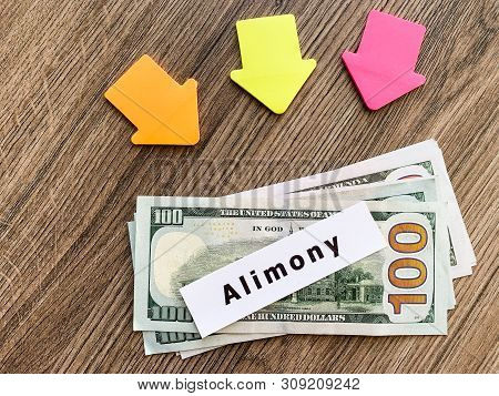 Payments Alimony. Pile Dollars With Sign Alimony And Money. Divorce And Separation Concept.