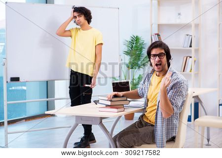 Two male students in the classroom