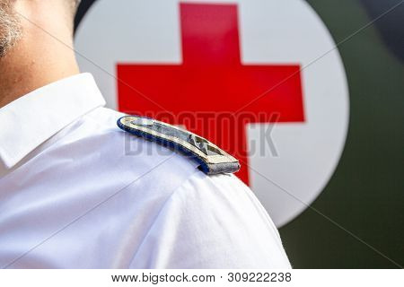Peine / Germany - June 22, 2019: German Paramedic Soldier Stands At Public Event, Day Of Uniform In 