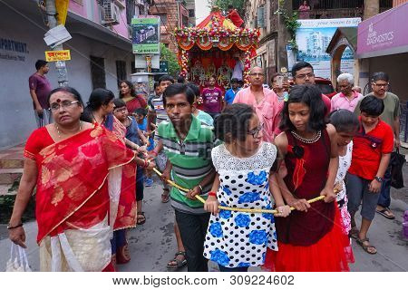 Howrah, West Bengal , India - July 22th 2018 : Young Bengali Hindu Devotees Dragging Holy Rope To Pu
