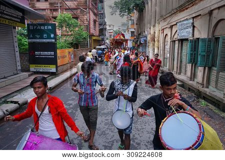 Howrah, West Bengal , India - July 22th 2018 : Drummers Playing Drums At Rath Jatra Festival, While 