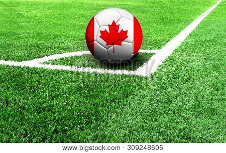 Soccer Ball On A Green Field, Flag Of Canada
