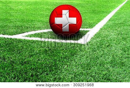 Soccer Ball On A Green Field, Flag Of Switzerland