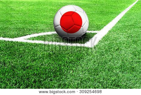Soccer Ball On A Green Field, Flag Of Japan