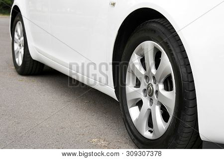 Kiev, Ukraine - July 2, 2018: White Opel Insignia, View Of The Car From The Bottom. Car Wheels Close