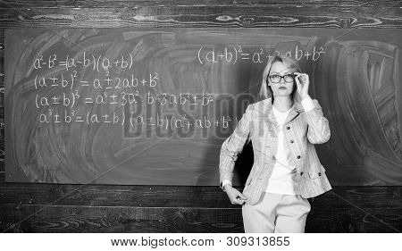 Preparing To The Exams. Teacher On School Lesson At Blackboard. Woman In Classroom. Study And Educat