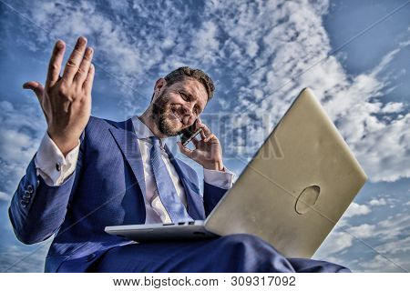 Sales Manager Responsibilities. Stay In Touch. Man Formal Suit Work With Laptop While Speak On Phone