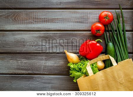 Buying Fresh Vegetables In Paper Bag On Wooden Background Top View Copyspace