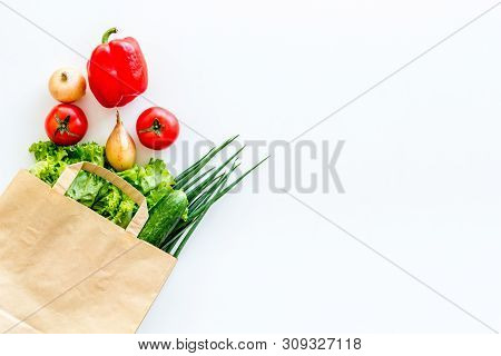 Buying Fresh Vegetables In Paper Bag On White Background Top View Copyspace