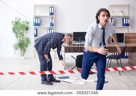 Forensic investigator investigating theft in the office