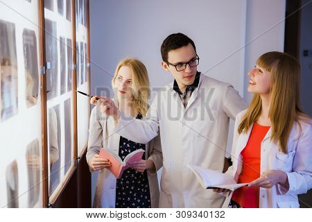 Group Of Nurse Studying The Sections Of The Brain. The Concept Of Health Education. Students In The 