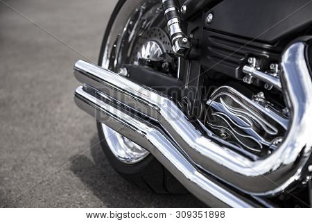 Motorcycle Exhaust Pipe. Chrome Shiny Clean Motorbike Tail-pipe. Close Up View.