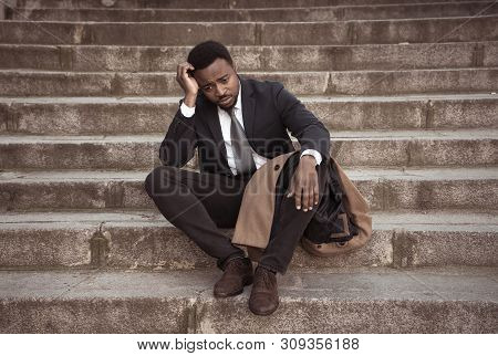 Sad Business Man Suffering From Depression In Total Despair Hopeless And Frustrated In City Stairs