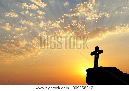 Silhouette Of Jesus Christ Crucifix On Cross Over Sunset.concept For Catholic Religion, Christian Wo