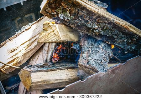 Only He Took Appeared The Fire Among The Wood-fire In The Grill