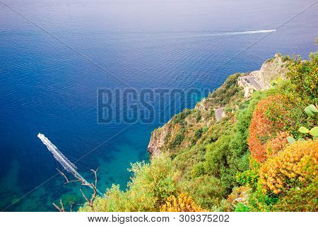 Beautiful Cozy Bay With Boats And Clear Turquoise Water In Italy