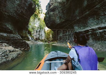 Tourist In Rubber Boat In Canyon. Martvili Canyon In Georgia.