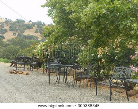 Black Wrought Iron Furniture In Drytown With Trees And Mountain
