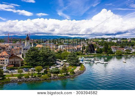 Aerial View Of Morges City Waterfront In The Border Of The Leman Lake In  Switzerland