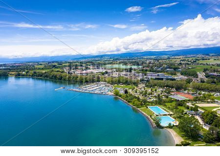 Aerial View Of Morges City Waterfront In The Border Of The Leman Lake In  Switzerland