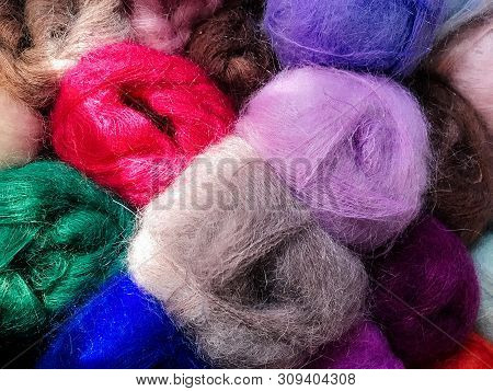 Texture Of Different Colored Balls Of Wool. Woolen Threads Of Different Colors. Conceptual For Hobbi