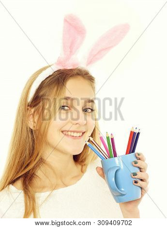 Happy Easter Girl Painter In Pink Bunny Ears With Colorful Pencil Set In Blue Cup For Drawing Hobby,