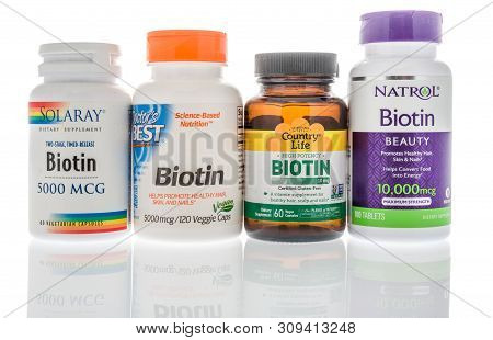Winneconne, Wi - 27 May 2019 : A Collection Of Biotin Supplements On An Isolated Background