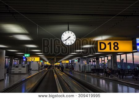 Amsterdam - Netherlands, November 15, 2018: Escalator Passing By The Gates Of Hall D Of Schiphol Air