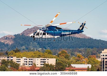 Victoria, Canada - October 02 2017: Helijet International Helicopter (cfzaa - Sikorsky S76) In Fligh