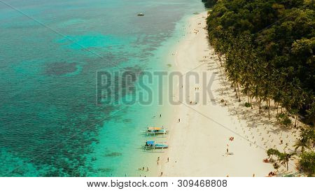 Tropical Landscape: Sandy Beach With Palm Trees And Turquoise Waters Of The Coral Reef Top View, Puk