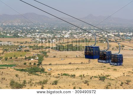 Pushkar, India - February 06, 2019: Hanging Cabins Of The Ropeway To Savitri Mata Temple On Ratnagir