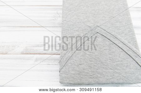 New Gray V Neck Shirt On White Wooden Background