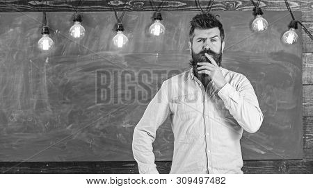 Intellectual Task Concept. Man With Beard And Mustache On Thoughtful Face Stand In Front Of Chalkboa