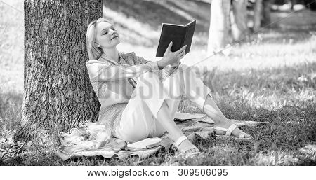 Self Improvement And Education Concept. Business Lady Find Minute To Read Book Improve Her Knowledge