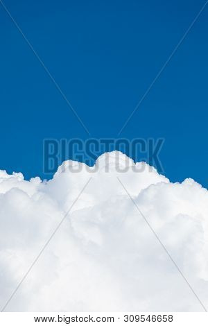 Rising Storm Cloud And Blue Sky Scape In Sunshine