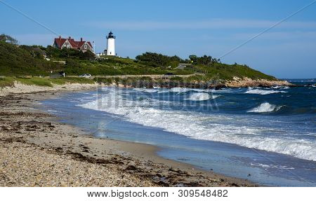 Heavy Surf At The Ocean Shore With A View Of Nobska Light Lighthouse