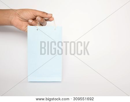 Hands Holding Colorfull Empty Blue Color Paper Shopping Bag On Isolated Background.