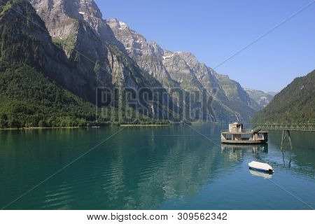 Mountains Of The Glaernisch Range And Clear Water Of Lake Kloental, Switzerland.