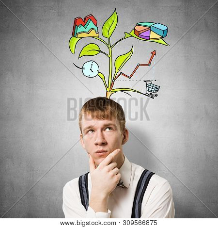 Redhead Student Looks Pensive Upwards And Thinking About Some Genius Idea. Clever Boy With Drawing I