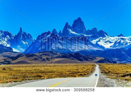 The road to the mountains. The border area between Argentina and Chile. Highway through the desert Patagonia goes to the magnificent mountain range Fitzroy. The concept of extreme, active tourism