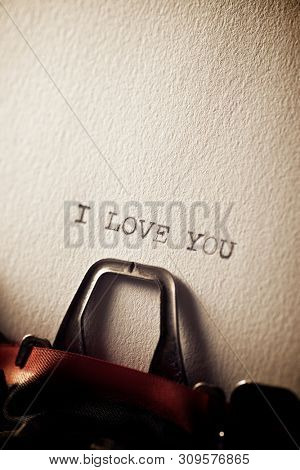 The sentence, Y Love You, written with a typewriter.