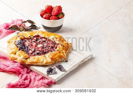 Homemade Strawberry Open Pie Gallet With Purple Basil And Balsamic Dressing On A Light Background. P